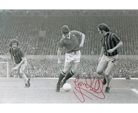 Autographed Gordon Hill 12 X 8 Photo: B/W, Depicting Manchester United's Gordon Hill In Full Length Action With The Ball At H