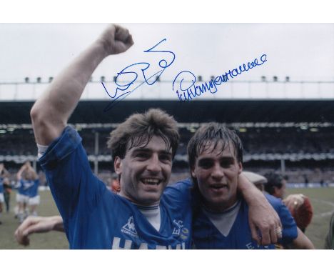 Autographed Everton 12 X 8 Photo: Col, Depicting Everton's Kevin Ratcliffe And Pat Van Den Hauwe Celebrating Together In Fron