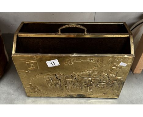 A vintage brass magazine rack