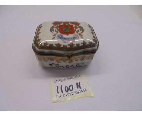 A 19th century porcelain trinket box. 