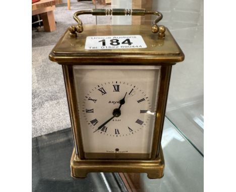 A brass carriage clock, in working order.