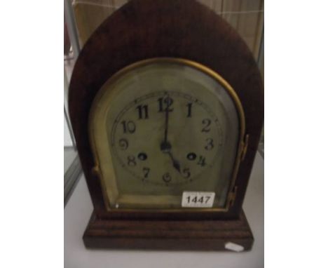 An oak eight day mantel clock in working order. 