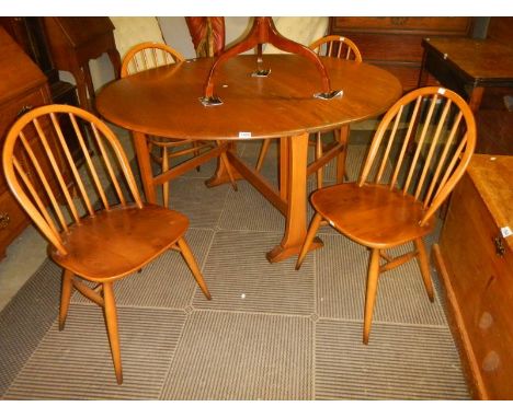 A vintage Ercol drop leaf table with four dining chairs, COLLECT ONLY. 