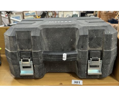 A cased Titan hand-held belt sander
