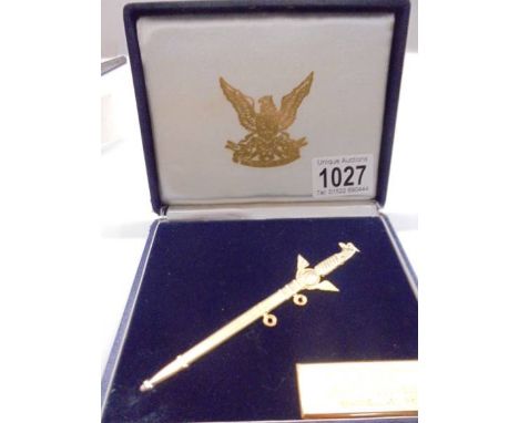 A cased RAF presentation dagger in yellow metal. 