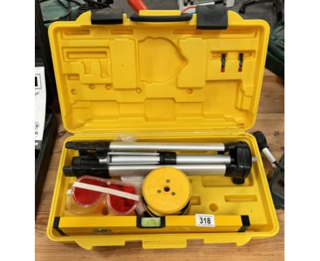 A cased Power Master spirit level &amp; tripod