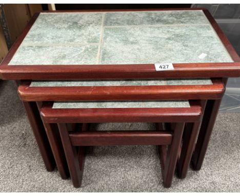 A tile top nest of tables