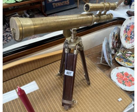 A brass telescope on tripod baseLenses in good condition