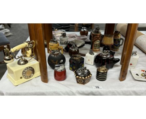 A collection of vintage novelty table lighters