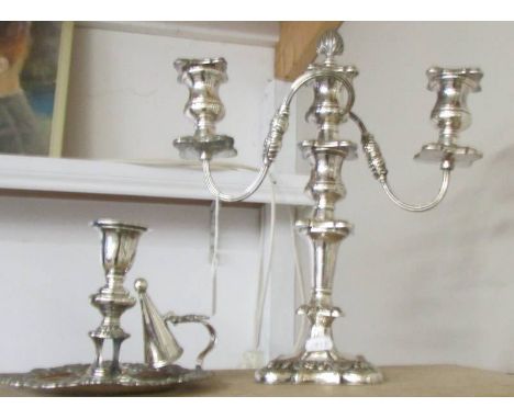 A silver plate candelbra and a silver plate chamber candlestick. 