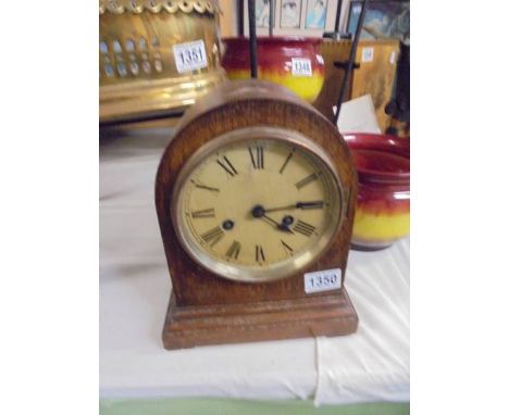 An arched top eight day mantel clock, in working order. 
