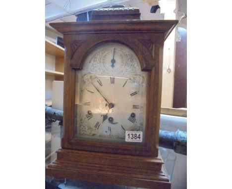 An oak mantel clock, in working order. 