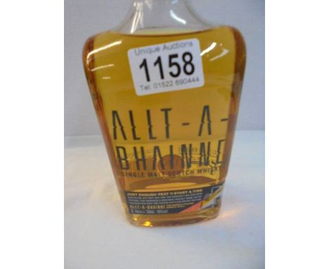 A bottle of Allt-A-Bhianne sweetly peated single malt Scotch whisky. 