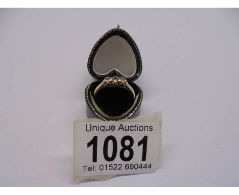 A vintage diamond three stone gold ring, size J half, 1.8 grams. 