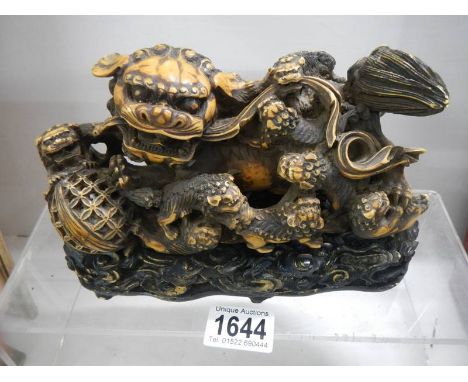 A 20th century model of a Chinese Temple Lion on a base. 