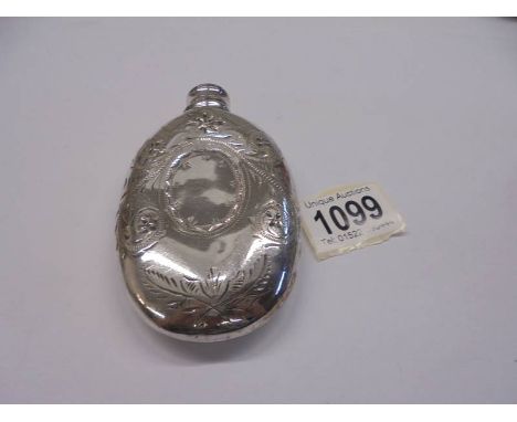 A silver plated hip flask. 