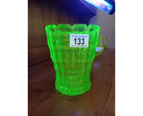 A fabulous art deco green uranium glass vase