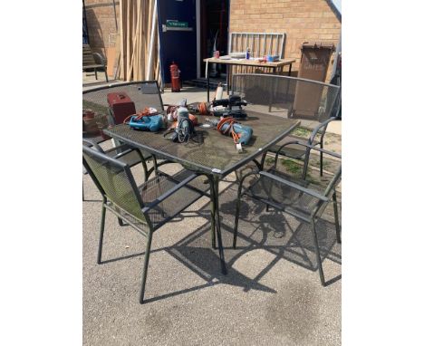 A metal garden furniture set including two benches, &amp; two chairs