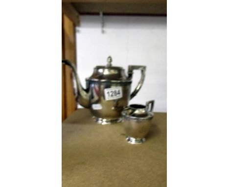 A continental (800) silver teapot and milk jug, 
