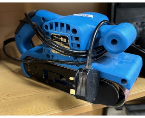 A Clark hand held belt sander