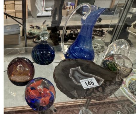 A quantity of paperweights, piece of agate and an art glass blue jug