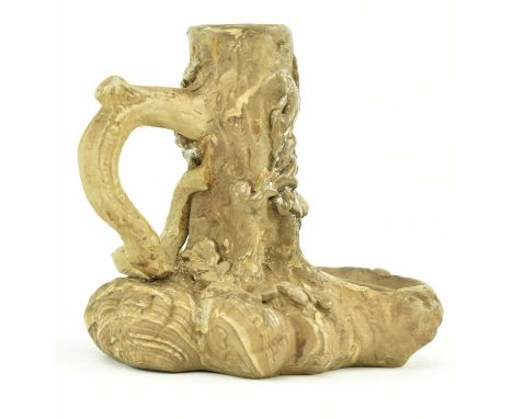 A vintage Villeroy and Boch terracotta candle stick. The candlestick modelled as an oak tree stump, decorated with leaves and