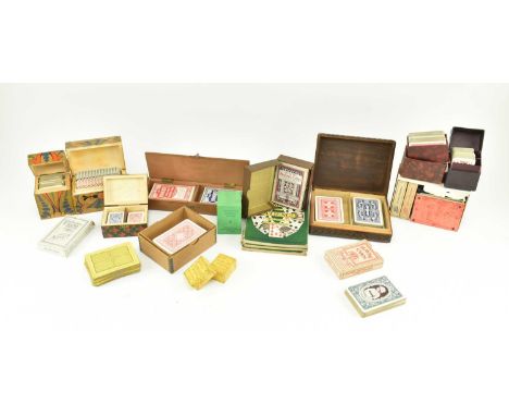 A collection of early 20th century &amp; later playing cards. The lot to include two decks of playing cards presented in wood