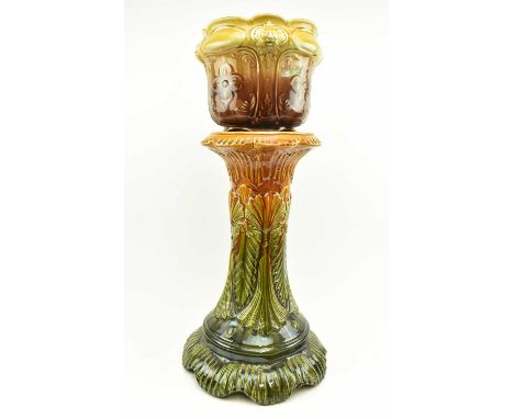 A late 19th century Victorian Aesthetic Movement majolica ceramic jardiniere on stand. The jardiniere &amp; stand in graduate