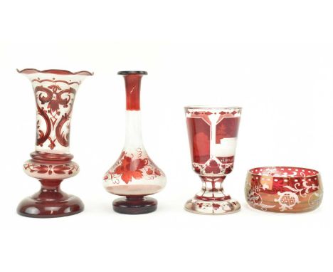 A collection of four 19th / 20th century Bohemian ruby glass items. The lot comprising two hand painted vases, a squat bowl a
