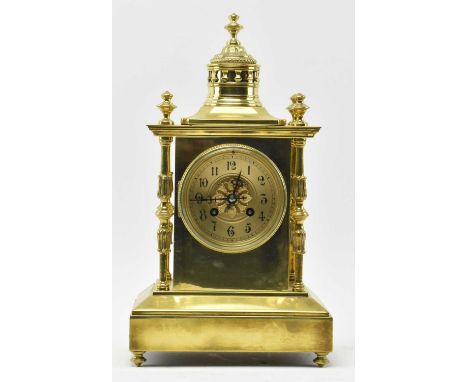 Japy Freres, Paris - a French Gothic Revival 19th century brass mantel clock. The mantle clock having a polished brass case w