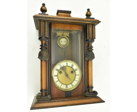 An early 20th century walnut cased Vienna regulator wall clock by the Hamburg American Clock Company. The clock with Roman nu
