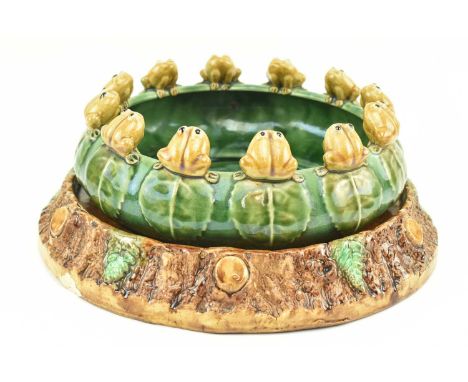 A 20th century Majolica style earthenware stoneware pottery bowl planter on mathcing ceramic stand. The bowl decorated with g