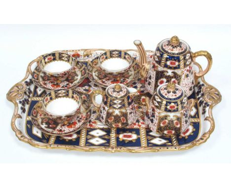 A Davenport Porcelain Cabaret Service, decorated in an Imari pattern, comprising, rectangular tray, teapot and cover, milk ju