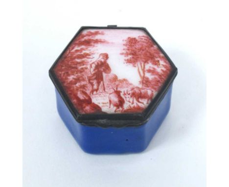 An XVIII Century Bilston Type Enamel Patch Box, of hexagonal form painted in puce with a shepherd and animals, the base blue,