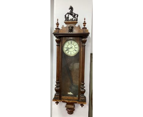 A Late XIX Century Walnut Cased Vienna Wall Clock, with two weights, the cream enamel dial with black Roman numerals with puc