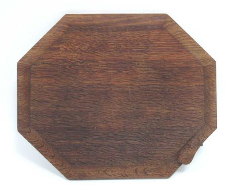 A Robert Tompson 'Mouseman' Oak Bread Board, of elongated octagonal form, carved with mouse trademark, 30cm long.