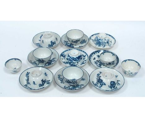 Eleven Caughley and Worcester Porcelain Tea Bowls and Nine Saucers, painted in underglaze blue with landscapes, flowers and f