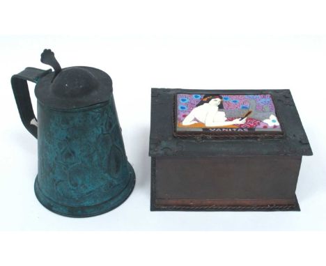 An Arts &amp; Crafts Copper Lidded Box, inset with an enamel panel painted with a semi-clad lady amongst peacocks, 15.5cm lon