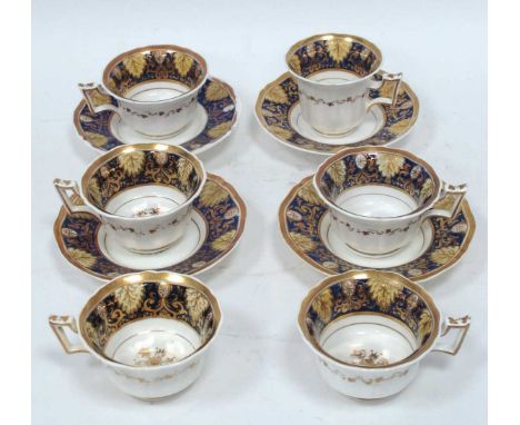 A Part Rockingham Porcelain Tea Service, painted in blue, cream and gilt with foliage and scrollwork, puce marks, comprising: