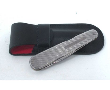 A Stan Shaw Five Blade Pen Knife, all stainless, engine turned decoration and black cartouche, brass worked lining, 8cm close