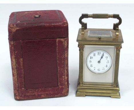 A French Late XIX Century Brass Repeater Carriage Clock, with column sides, the white enamel dial with Arabic numerals, stamp