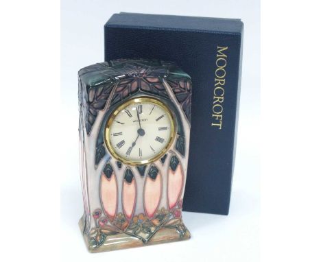 A Moorcroft Pottery Mantel Clock, in the 'Cluny' pattern, painted and impressed marks, 16cm high (boxed).crackle to glaze, cl
