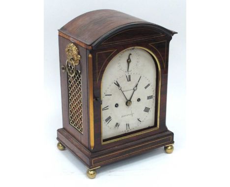 A Mid XIX Century Rosewood Bracket Clock, with brass inlay fretwork side panels with ring handles, raised on ball feet, the w