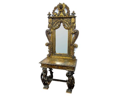 A XIX Century Continental Carved Giltwood Console Table and Matching Mirror, the console table with a marbelised top and moul