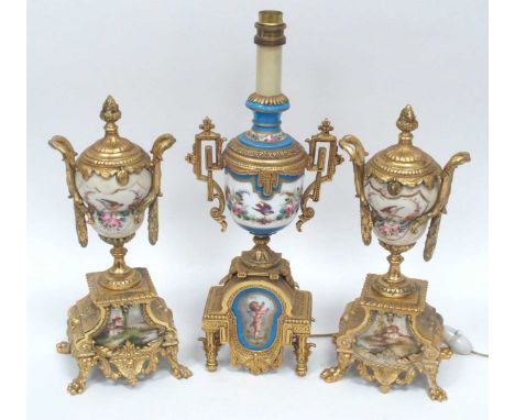 A Pair of Late XIX Century Clock Ornaments, the elaborate porcelain panels decorated with flowers, birds and landscape scenes