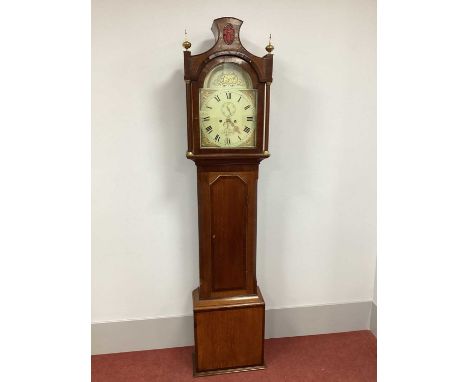 An Early XIX Century Mahogany and Oak Eight-Day Longcase Clock, the hood with shaped pediment and brass finials, arched door 