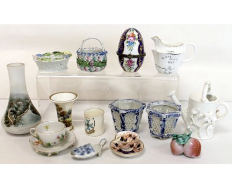 Small collection of miniature pottery & porcelain items including two floral encrusted baskets, spill vase, tea cups & saucer