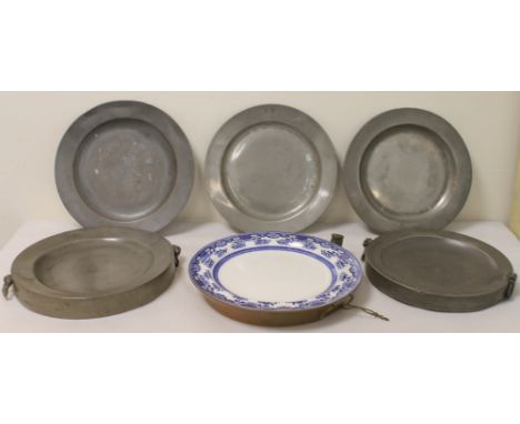 Two English pewter circular hot water plates, one with maker's mark for Thomas Bacon, 24 & 22.5cm diam.; another ceramic & co