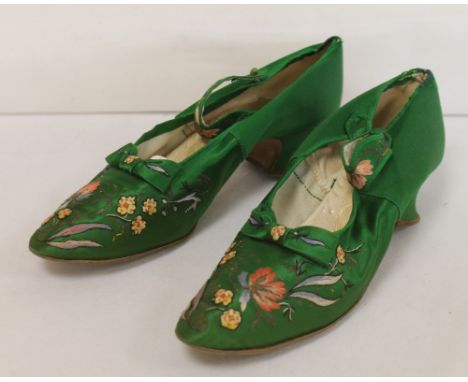 Pair of late 19th century Monquignon, Paris, emerald green silk lady's evening shoes, with 1¼" wine glass heel, button strap,