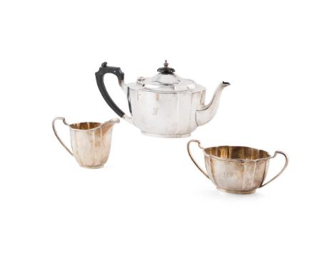 A 1930s three-piece tea-service M M Henderson Ltd (of Glasgow), Birmingham 1934, comprising a teapot, twin handled sugar basi